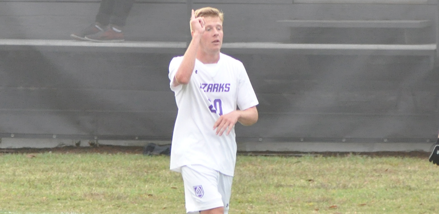 Drew Mott points to the sky after scoring a goal against Hendrix College. The Eagles won 3-0.