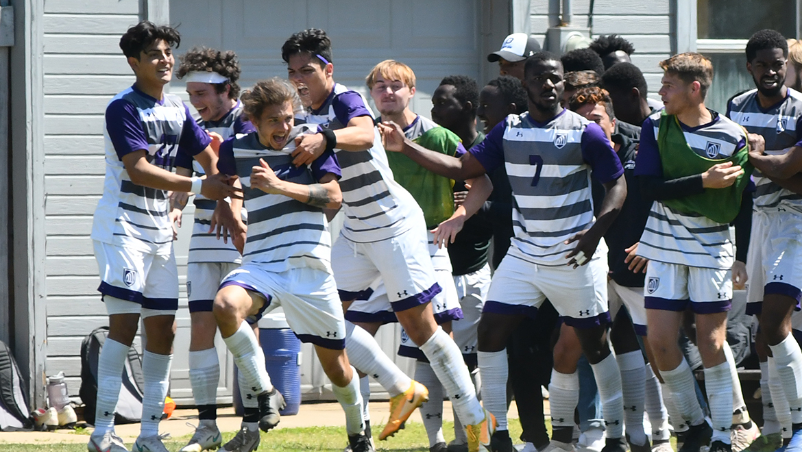 The men's soccer team celebrates after a goal by Kyle Seymour. 