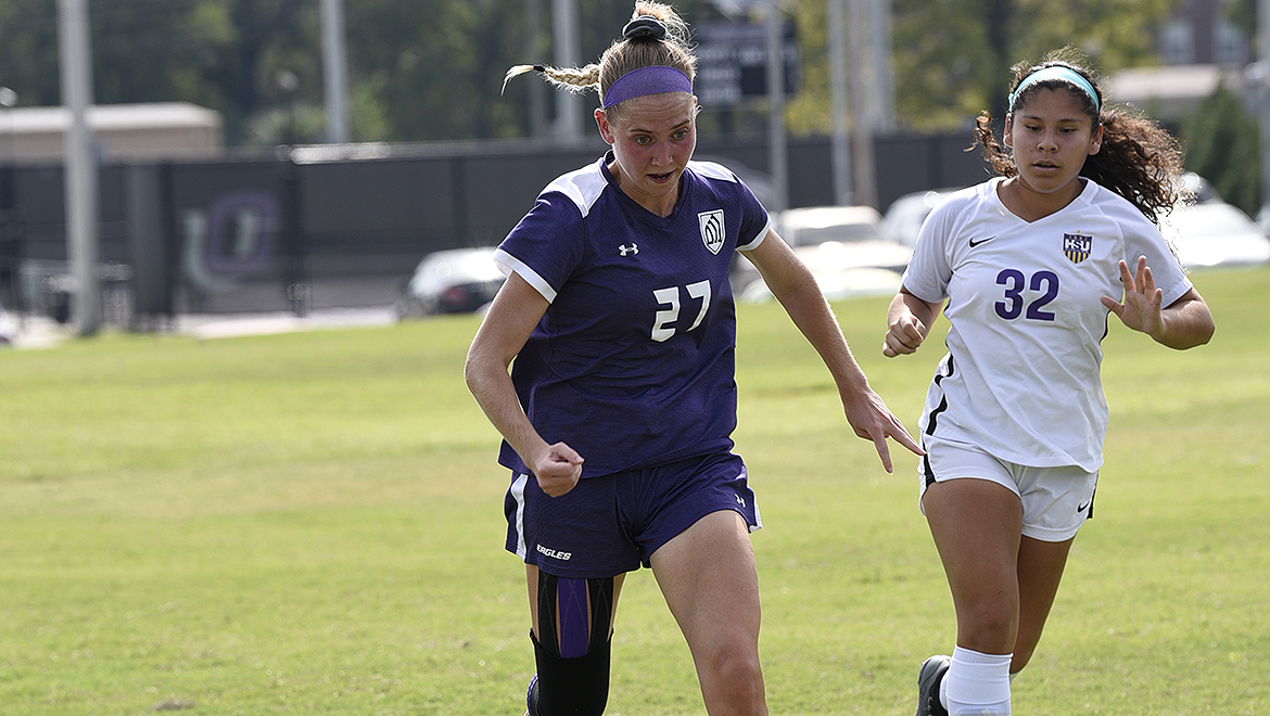 Lara Wadle takes the ball down field against Hardin-Simmons.