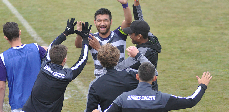 Miguel Reyes celebrates with his teammates after scoring two goals in a win against Belhaven.