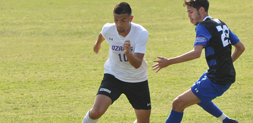Miguel Reyes attacks a Berry College defender.