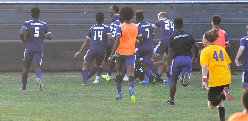 Celebration ensues after Charleus Ritch scores game-winner.
