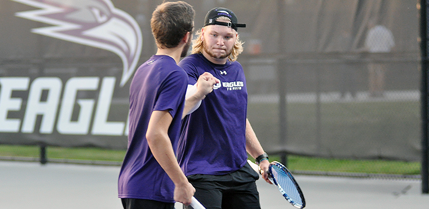 Cason and Johnson celebrate a 8-4 win at No. 3 doubles against Hendrix College.